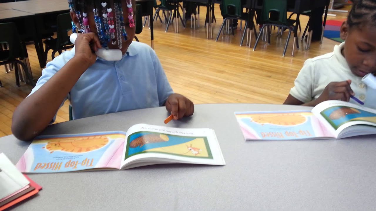 students using whisper phones during guided reading